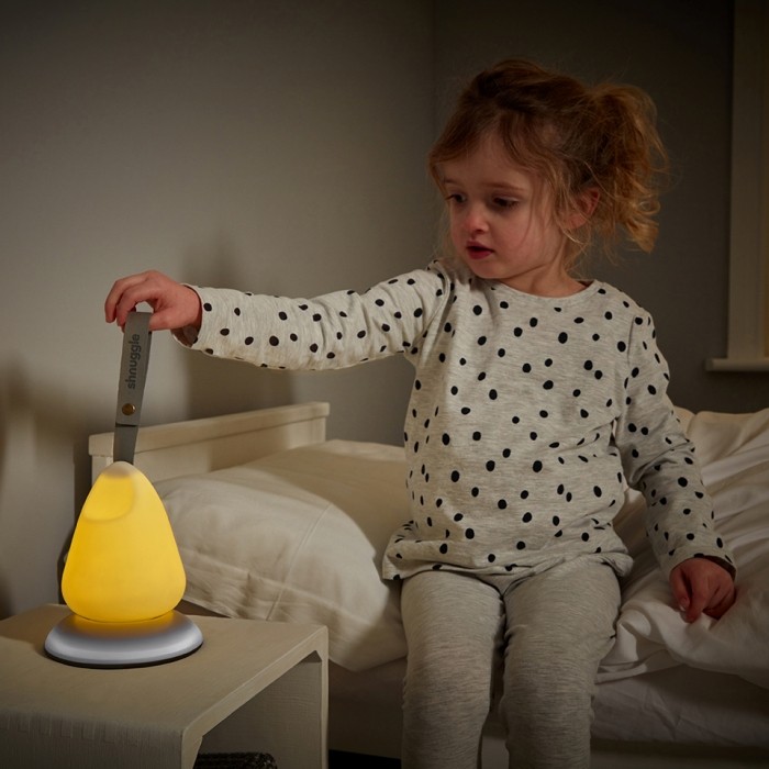 Little-Girl-Holding-Nightlight-Sitting-on-Bed-Squared-Low-Res